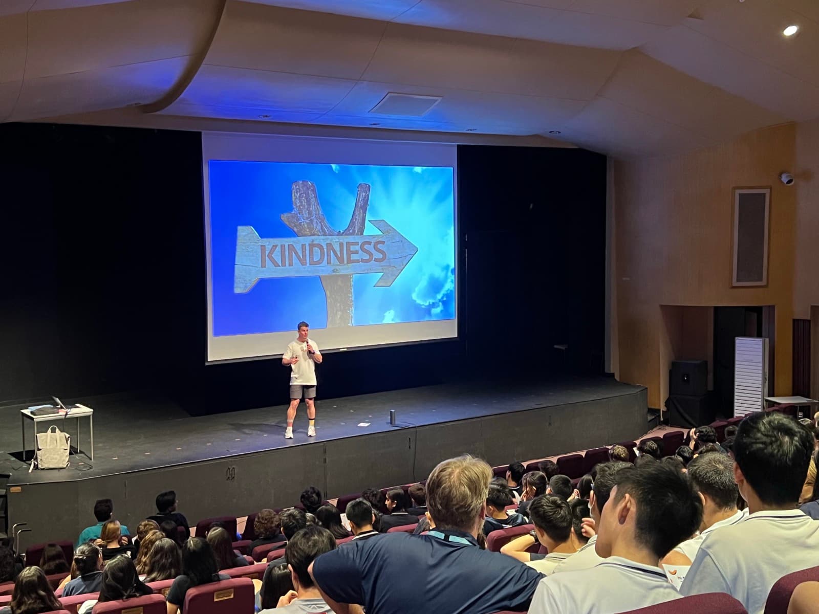 Dale Sidebottom delivering a keynote to a full auditorium in Bangkok